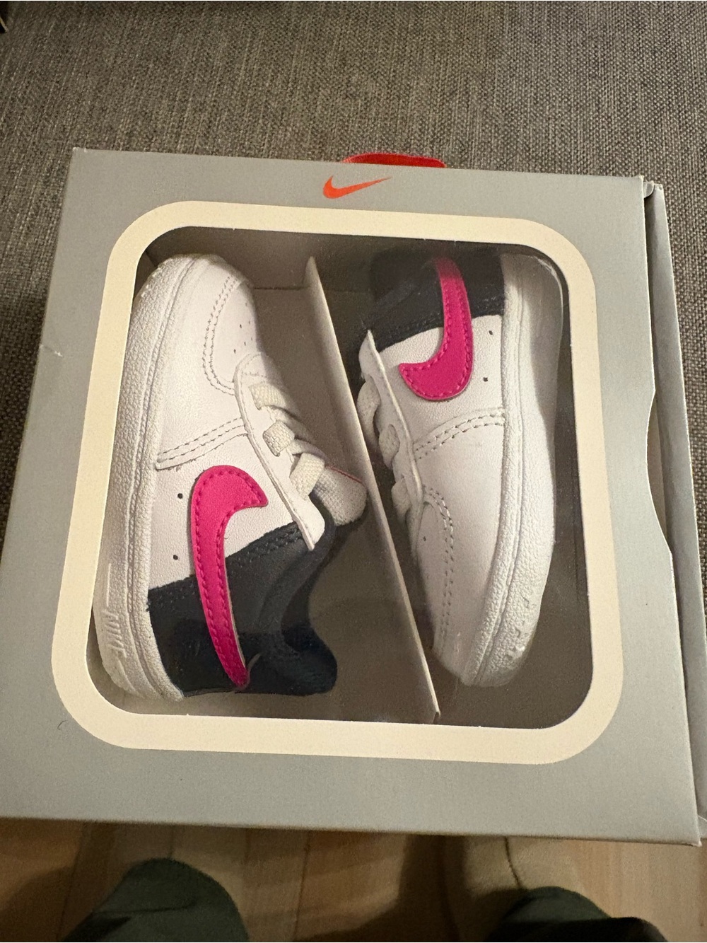 Nike Baby White Sneakers with Pink Swoosh and Navy Accent